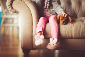 child sitting with bunny slippers